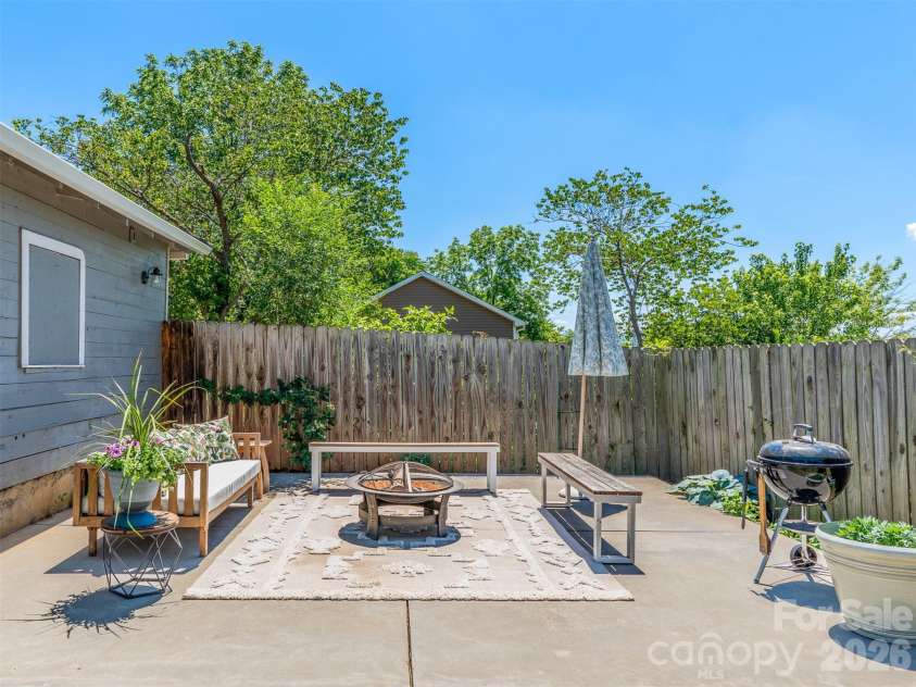 310 Hazel Mill Road, Asheville, NC 28806.  MLS# CAR4385682, YatesRealty ID 28409. Back yard patio perfect for entertaining