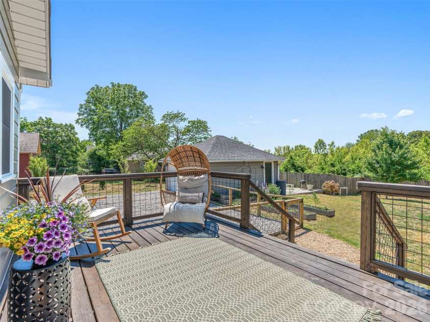 310 Hazel Mill Road, Asheville, NC 28806.  MLS# CAR4385682, YatesRealty ID 28409. Deck overlooking the back yard and gardens