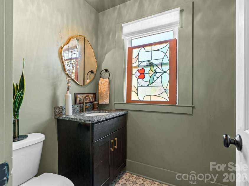 310 Hazel Mill Road, Asheville, NC 28806.  MLS# CAR4385682, YatesRealty ID 28409. Main level half bath