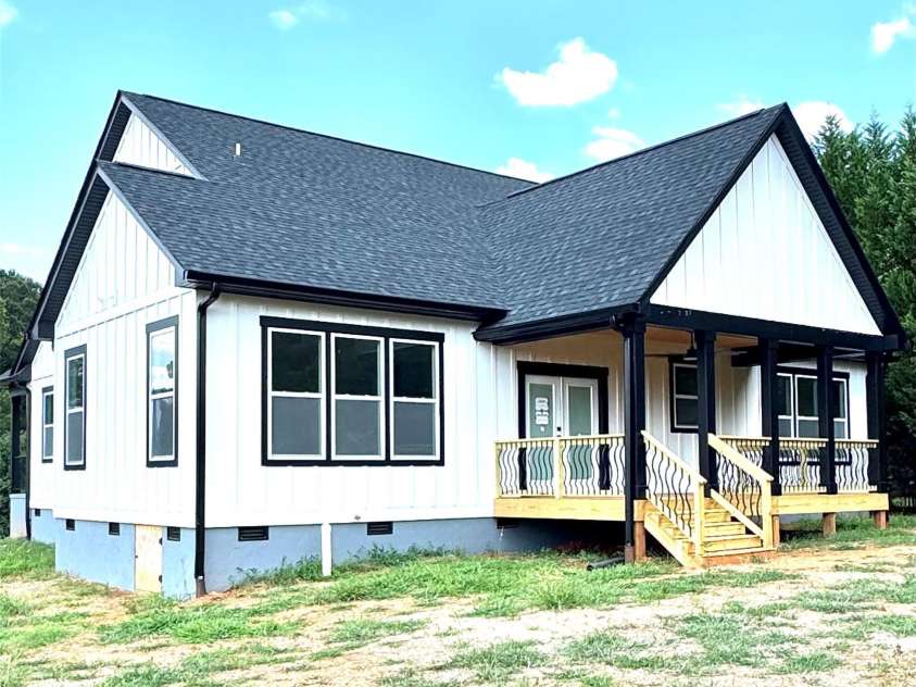 2589 Polo Lane, Maiden, NC 28650.  MLS# CAR4264750, YatesRealty ID 28419. Rear view of home with covered rear deck with wood ceilings and 72