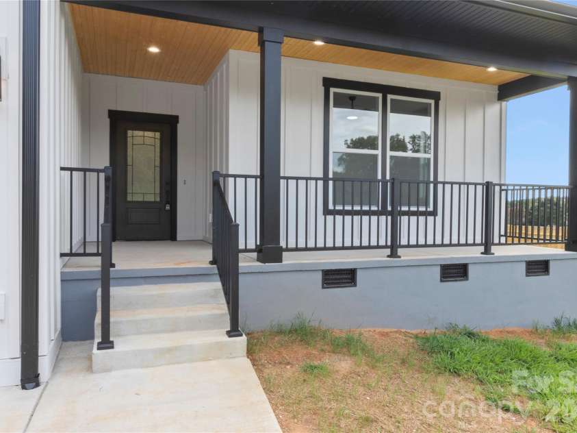 2589 Polo Lane, Maiden, NC 28650.  MLS# CAR4299931, YatesRealty ID 28419. Front entrance area of home. Enter into the covered front porch with wooden ceilings