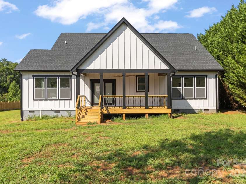 2589 Polo Lane, Maiden, NC 28650.  MLS# CAR4299931, YatesRealty ID 28419. Great view of rear of home. The rear covered deck is beautiful. No septic in back yard so a small pool is a possibility.