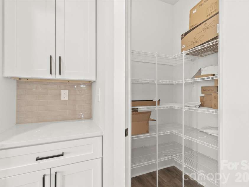 2589 Polo Lane, Maiden, NC 28650.  MLS# CAR4299931, YatesRealty ID 28419. Large pantry with extra row of shelving.The countertop area can be a coffee station. It sits in between refrigerator and pantry