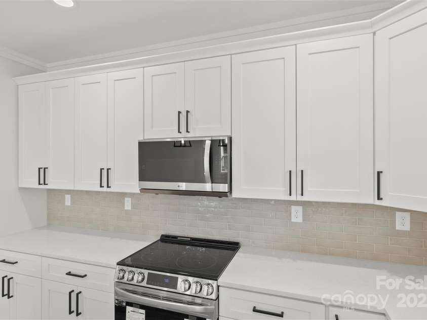 2589 Polo Lane, Maiden, NC 28650.  MLS# CAR4299931, YatesRealty ID 28419. LG slide in range with the blue ceramic inside. Upgraded appliances. Stainless steel inside dishwasher. NO builder grade in this custom home.