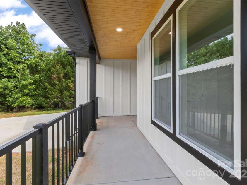 2589 Polo Lane, Maiden, NC 28650.  MLS# CAR4299931, YatesRealty ID 28419. The wood ceiling is such a nice finish on front porch. The rear deck also has this upgrade feature.