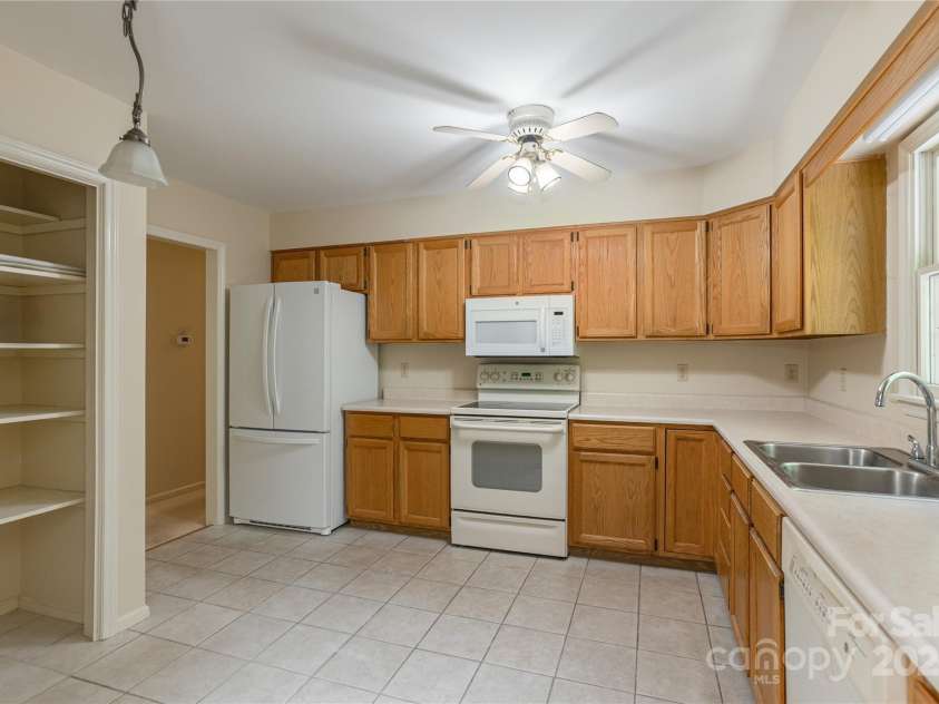 104 Creekstone Lane, Hendersonville, NC 28791.  MLS# CAR4285829, YatesRealty ID 28429. Kitchen with tons of counters and pantry