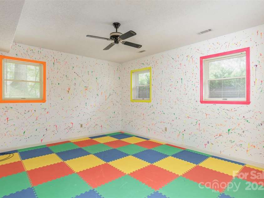 104 Creekstone Lane, Hendersonville, NC 28791.  MLS# CAR4285829, YatesRealty ID 28429. Lower Level Playroom
