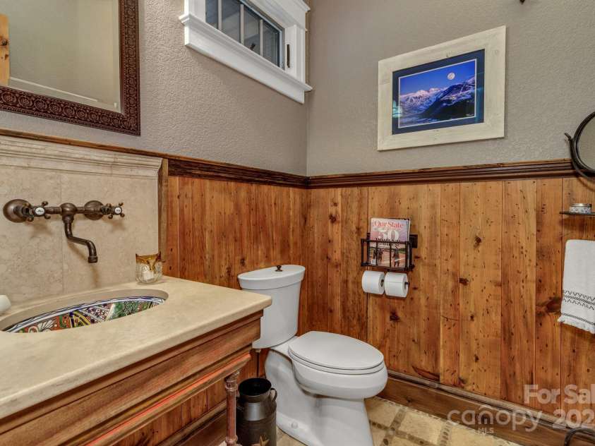 29 Bonnie Brae Drive, Weaverville, NC 28787.  MLS# CAR4266285, YatesRealty ID 28435. Beautiful wood wainscoting in the main level guest powder room
