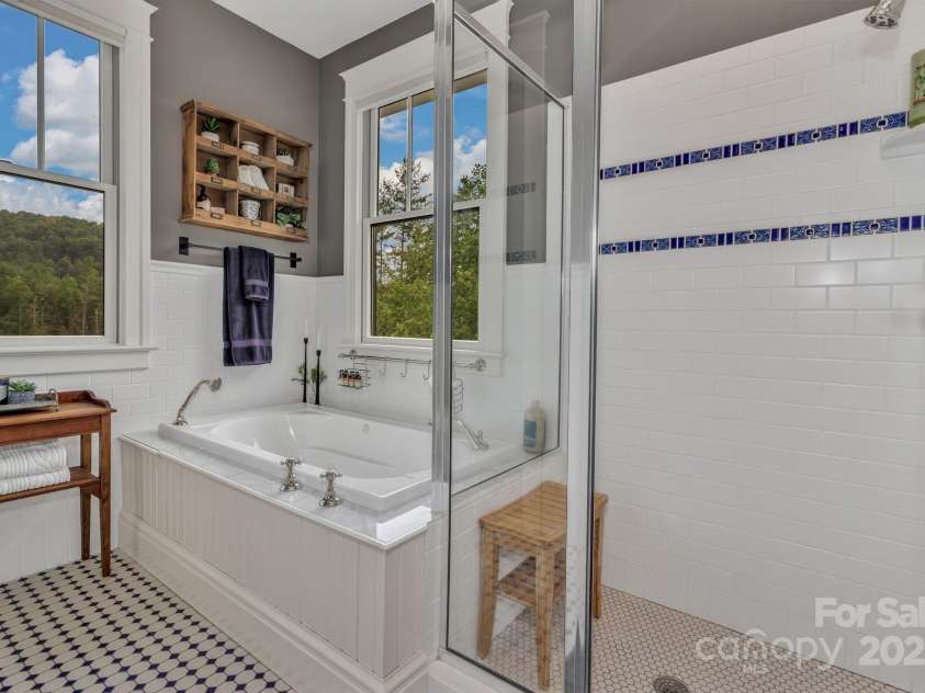 29 Bonnie Brae Drive, Weaverville, NC 28787.  MLS# CAR4266285, YatesRealty ID 28435. Full en-suite in guest bedroom #1 overlooking the pasture and has a large covered sitting porch