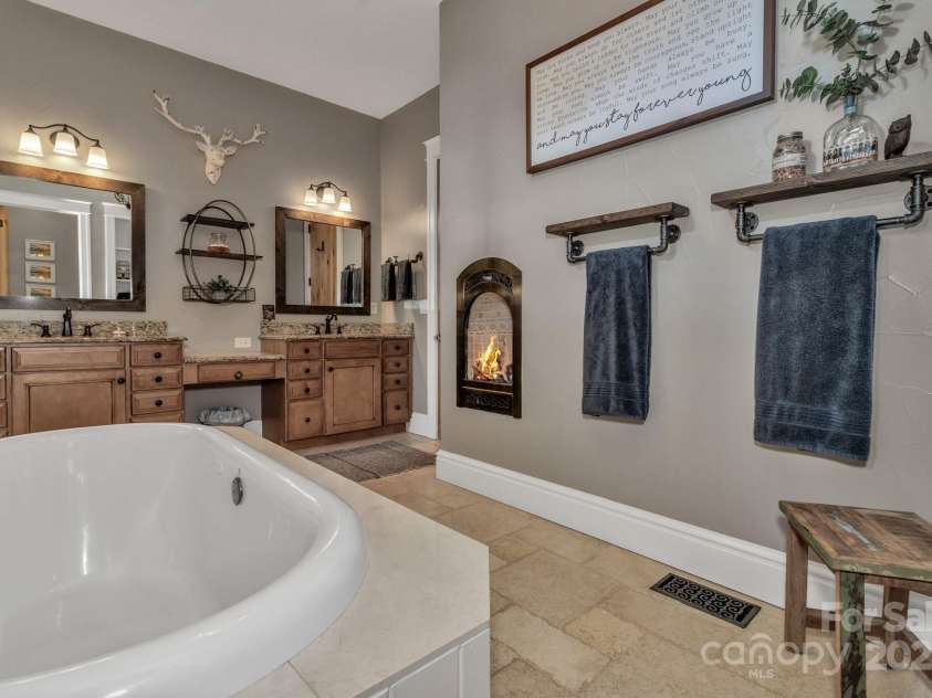 29 Bonnie Brae Drive, Weaverville, NC 28787.  MLS# CAR4266285, YatesRealty ID 28435. Jetted bath tubs in primary and guest suite Gas fireplace in primary bathroom