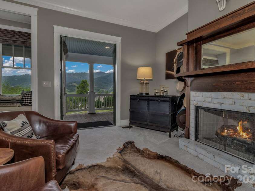 29 Bonnie Brae Drive, Weaverville, NC 28787.  MLS# CAR4266285, YatesRealty ID 28435. Reclaimed farmhouse mantels in primary bedroom and guest suite