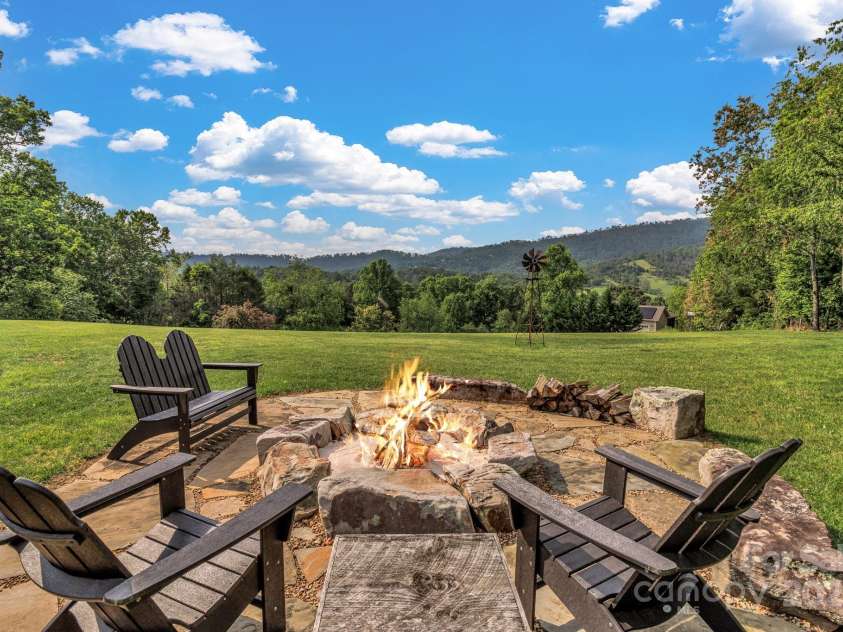 29 Bonnie Brae Drive, Weaverville, NC 28787.  MLS# CAR4266285, YatesRealty ID 28435. Sit by this beautiful hand crafted stone fireplace to take in the peaceful setting with friends and loved ones. Overlooking Reems Creek Golf Course Community and pastoral farmland