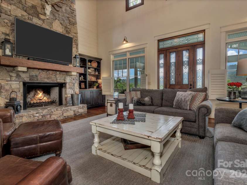 29 Bonnie Brae Drive, Weaverville, NC 28787.  MLS# CAR4266285, YatesRealty ID 28435. Two-story woodburning stone fireplace with gas starter in living room