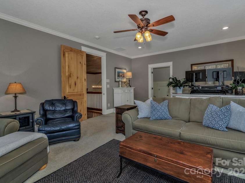 29 Bonnie Brae Drive, Weaverville, NC 28787.  MLS# CAR4266285, YatesRealty ID 28435. Upper level guest bedroom #2 being used as an office/bedroom with a fireplace.