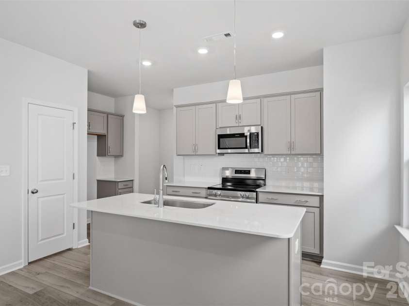 5831 Tuckaseegee Road, Charlotte, NC 28208.  MLS# CAR4349148, YatesRealty ID 2844. Homesite 10 features an end-unit Cannalily C floorplan! Please note that photos are representative only. 