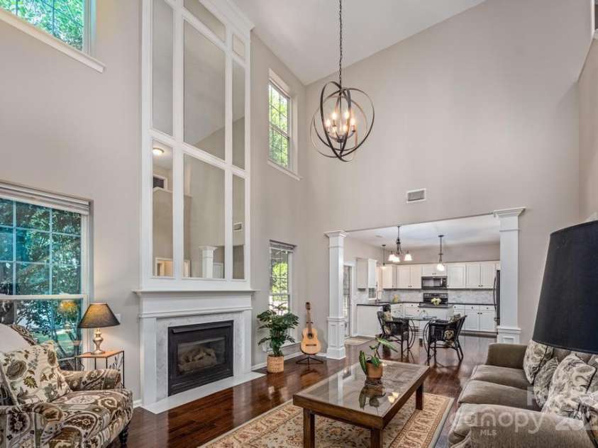 8412 Bridgestone Drive, Huntersville, NC 28078.  MLS# CAR4278792, YatesRealty ID 28445. Cozy fireplace w. marble surround