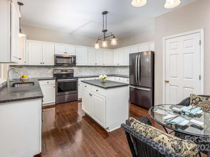 8412 Bridgestone Drive, Huntersville, NC 28078.  MLS# CAR4278792, YatesRealty ID 28445. Kitchen w. island and updated black stainless steel appliances