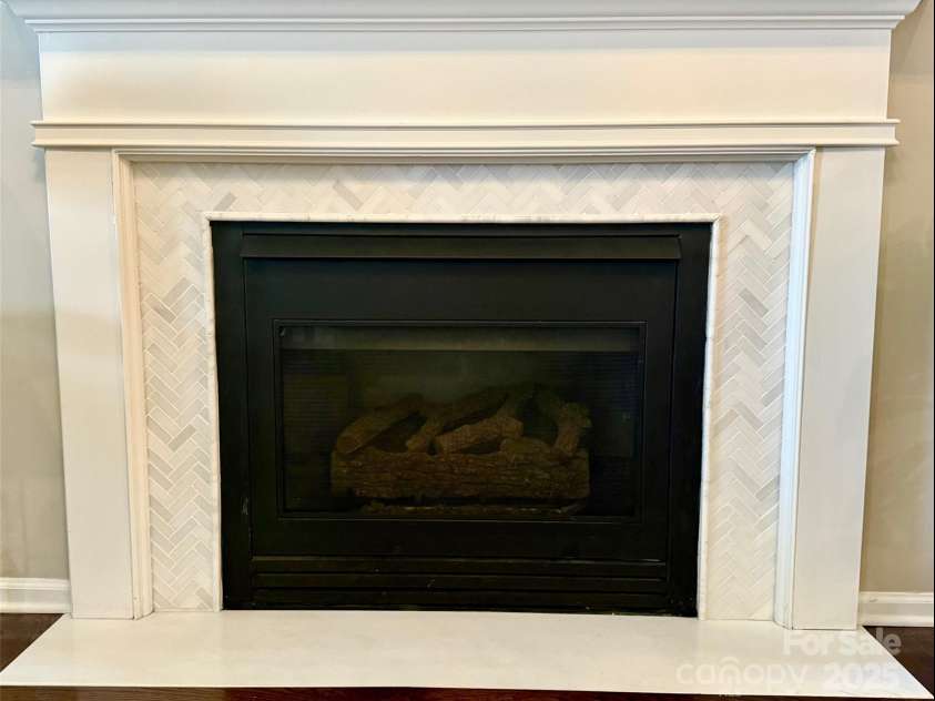 8412 Bridgestone Drive, Huntersville, NC 28078.  MLS# CAR4278792, YatesRealty ID 28445. Stunning fireplace with marble surround.
