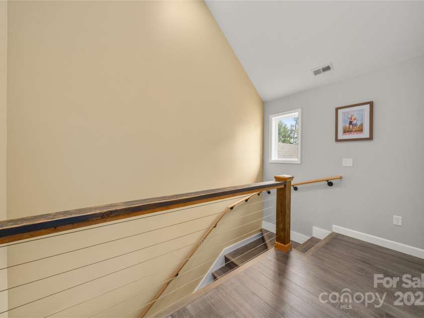 134 Olivia Trace Drive, Fletcher, NC 28732.  MLS# CAR4257309, YatesRealty ID 28446. Beautiful, custom  cable and wood railings in the upper level hallway
