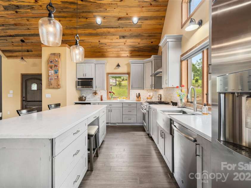 134 Olivia Trace Drive, Fletcher, NC 28732.  MLS# CAR4257309, YatesRealty ID 28446. Clever seating in island to promote conversations on both sides