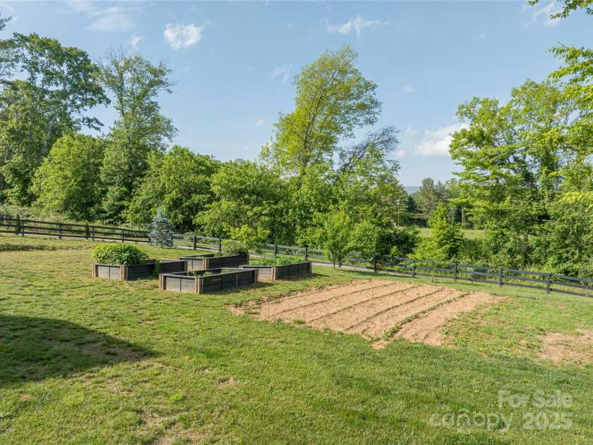 134 Olivia Trace Drive, Fletcher, NC 28732.  MLS# CAR4257309, YatesRealty ID 28446. Live off the land from the fertile gardens and fruit trees