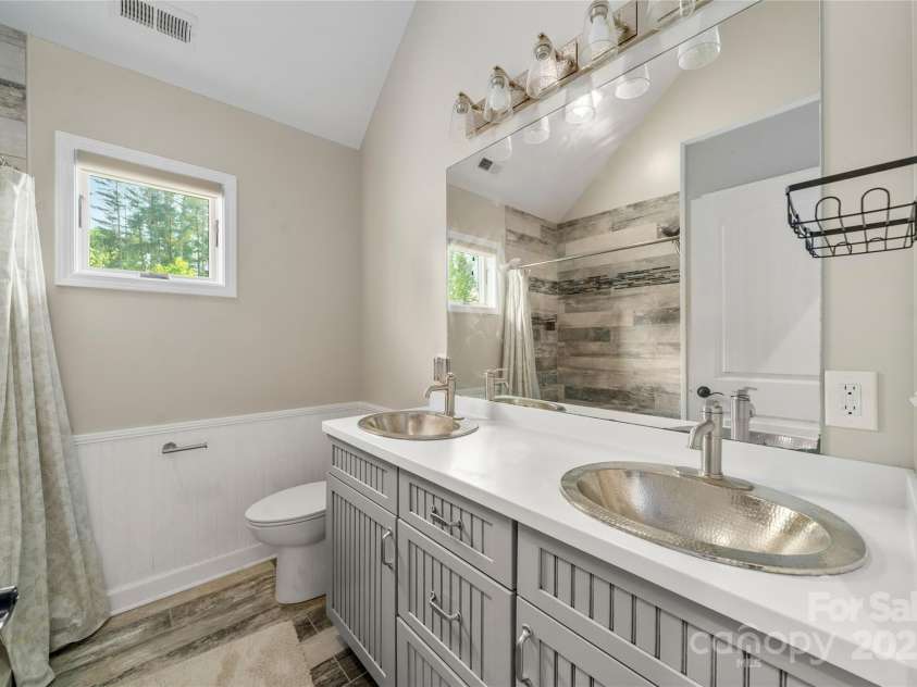 134 Olivia Trace Drive, Fletcher, NC 28732.  MLS# CAR4257309, YatesRealty ID 28446. Lovely upper level bathroom is spacious and conveniently located