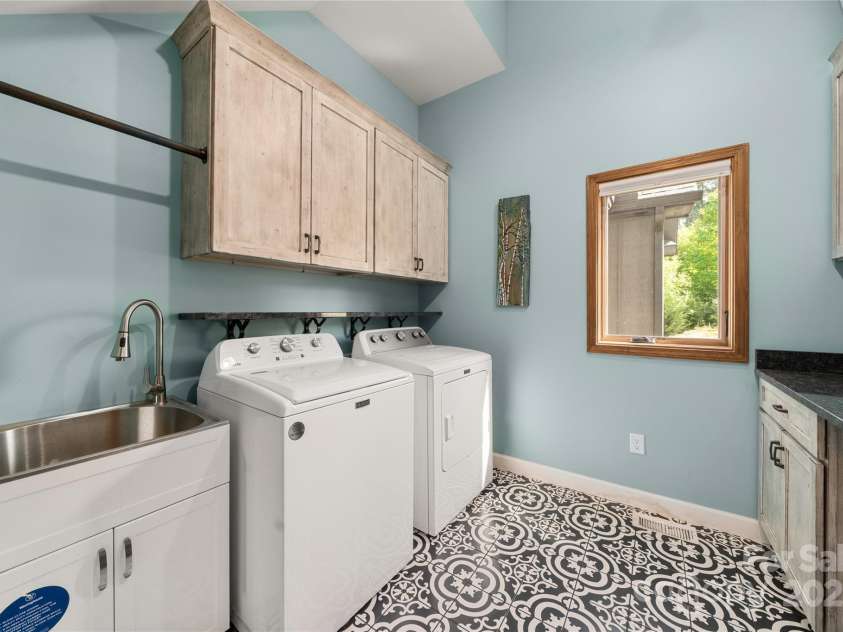 134 Olivia Trace Drive, Fletcher, NC 28732.  MLS# CAR4257309, YatesRealty ID 28446. Main level laundry room with utility sink