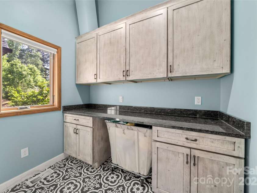 134 Olivia Trace Drive, Fletcher, NC 28732.  MLS# CAR4257309, YatesRealty ID 28446. Super sized utility room with ample storage and folding area