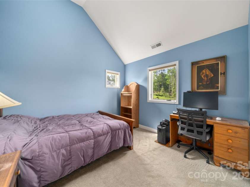 134 Olivia Trace Drive, Fletcher, NC 28732.  MLS# CAR4257309, YatesRealty ID 28446. Upper level bedroom two with cathedral ceilings