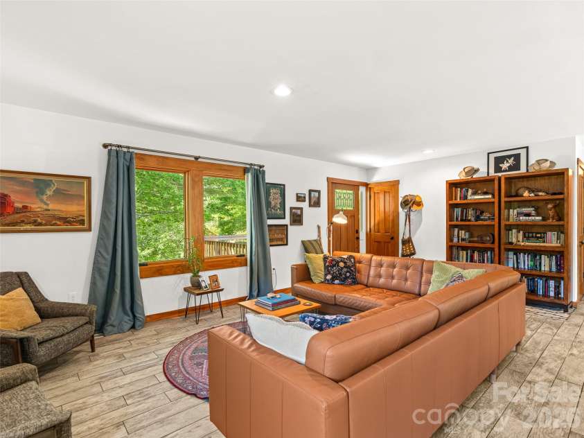 241 Pinners Cove Road, Asheville, NC 28803.  MLS# CAR4385845, YatesRealty ID 28453. Great natural light in the living room.