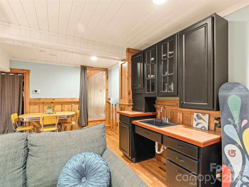 241 Pinners Cove Road, Asheville, NC 28803.  MLS# CAR4385845, YatesRealty ID 28453. Wet bar in lower level rec room