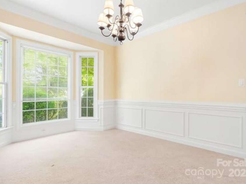 16028 Hallaton Drive, Huntersville, NC 28078.  MLS# CAR4254854, YatesRealty ID 28460. Dining room with beautiful chair-rail molding