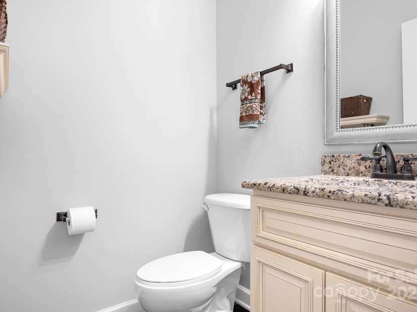 16028 Hallaton Drive, Huntersville, NC 28078.  MLS# CAR4254854, YatesRealty ID 28460. Downstairs Powder bathroom