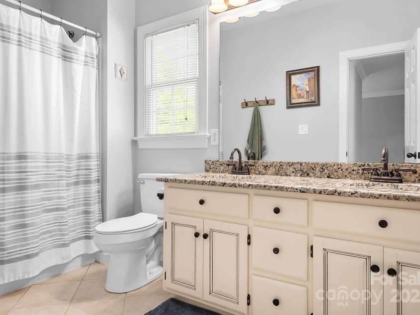 16028 Hallaton Drive, Huntersville, NC 28078.  MLS# CAR4254854, YatesRealty ID 28460. Upstairs bathroom with double sink vanity
