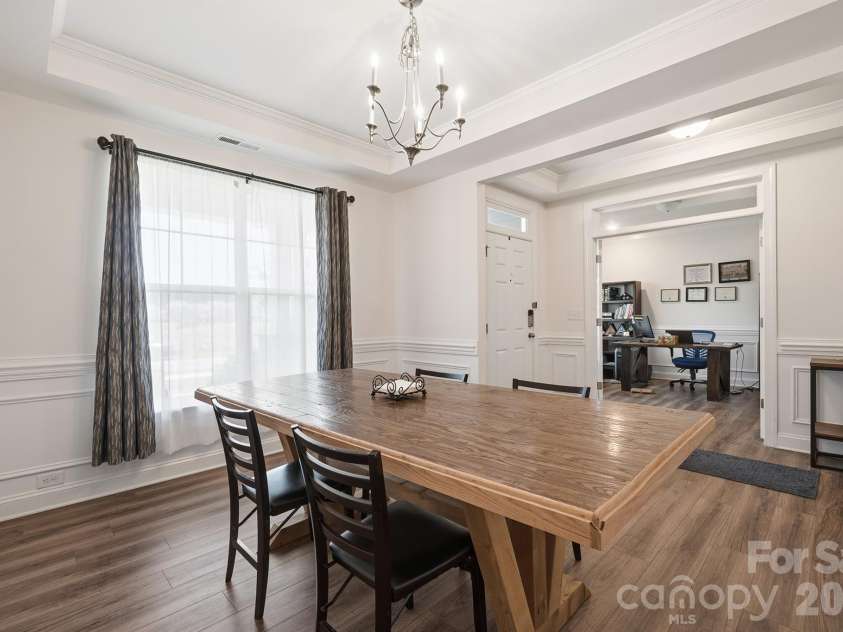 282 Bouchard Drive, Waxhaw, NC 28173.  MLS# CAR4387883, YatesRealty ID 28465. Dining Room Featuring Tray Ceilings and Wainscoting