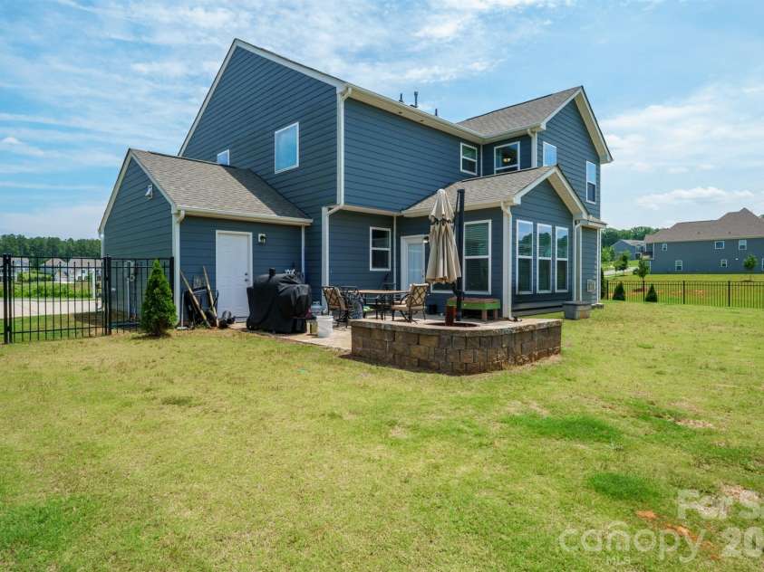 282 Bouchard Drive, Waxhaw, NC 28173.  MLS# CAR4387883, YatesRealty ID 28465. Fully Fenced Backyard with Paver Patio and Firepit