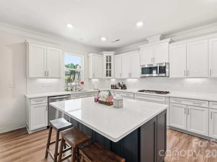 282 Bouchard Drive, Waxhaw, NC 28173.  MLS# CAR4387883, YatesRealty ID 28465. Oversized Kitchen Island with Quartz Countertops