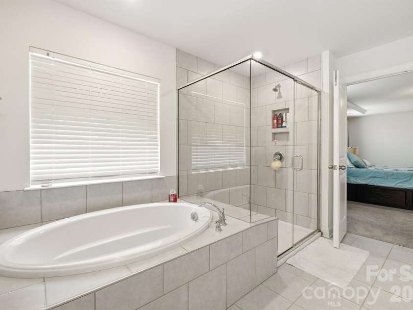 282 Bouchard Drive, Waxhaw, NC 28173.  MLS# CAR4387883, YatesRealty ID 28465. Primary Soaking Tub + Shower