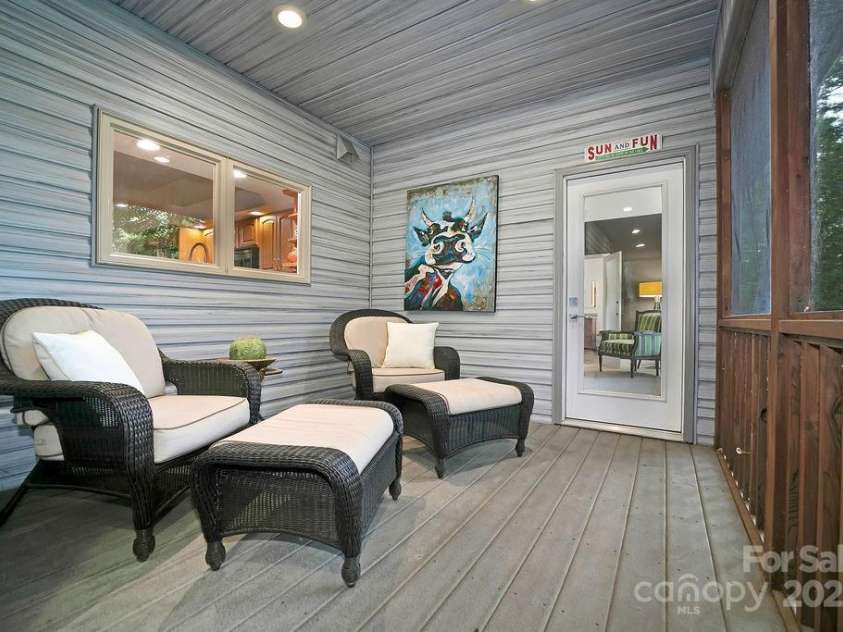 66 Ottaray Court, Brevard, NC 28712.  MLS# CAR4280807, YatesRealty ID 28466. Cozy, sitting area & door from primary suite to screened porch.