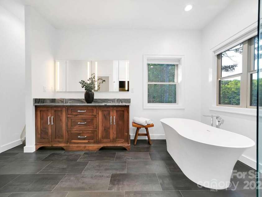 66 Ottaray Court, Brevard, NC 28712.  MLS# CAR4280807, YatesRealty ID 28466. Custom, alder wood cabinet with natural quartz stone top