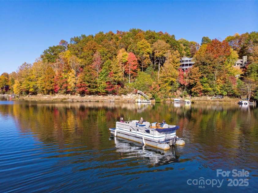 66 Ottaray Court, Brevard, NC 28712.  MLS# CAR4280807, YatesRealty ID 28466. Enjoy swimming, boating & fishing steps from your home.