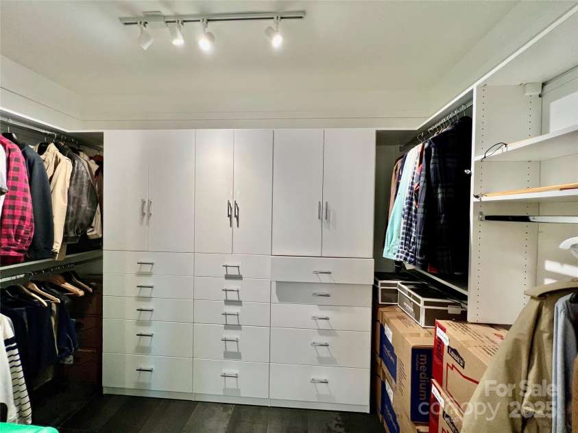 66 Ottaray Court, Brevard, NC 28712.  MLS# CAR4280807, YatesRealty ID 28466. Expansive walk-in closet with drawers & cabinets for organization