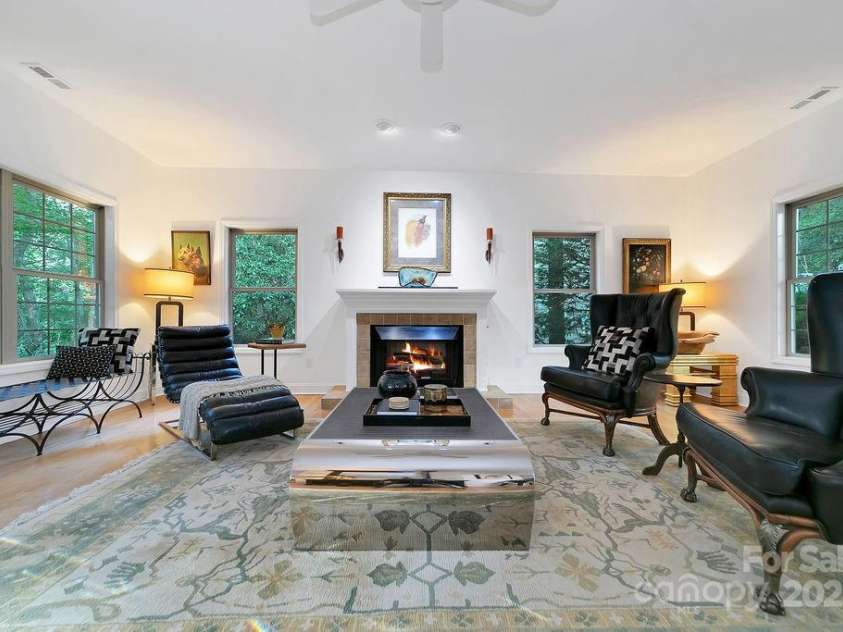 66 Ottaray Court, Brevard, NC 28712.  MLS# CAR4280807, YatesRealty ID 28466. Huge windows bring the outside in