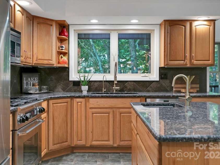 66 Ottaray Court, Brevard, NC 28712.  MLS# CAR4280807, YatesRealty ID 28466. Lake views from the kitchen window.