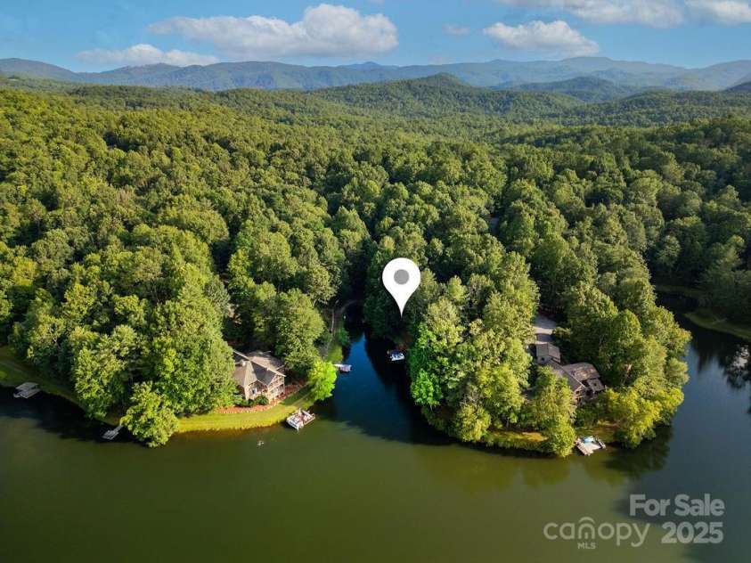 66 Ottaray Court, Brevard, NC 28712.  MLS# CAR4280807, YatesRealty ID 28466. Located on Lake Tiaroga, Connestee's most serene lake.