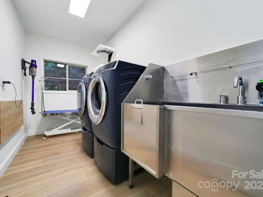 66 Ottaray Court, Brevard, NC 28712.  MLS# CAR4280807, YatesRealty ID 28466. Roomy laundry room complete with dog-washing station!