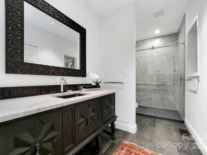 66 Ottaray Court, Brevard, NC 28712.  MLS# CAR4280807, YatesRealty ID 28466. Stunning, lower-level fully renovated full bath