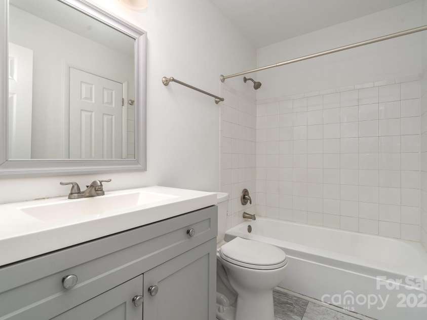 4900 Spring Lake Drive, Charlotte, NC 28212.  MLS# CAR4284345, YatesRealty ID 28468. Renovated Bathroom 1