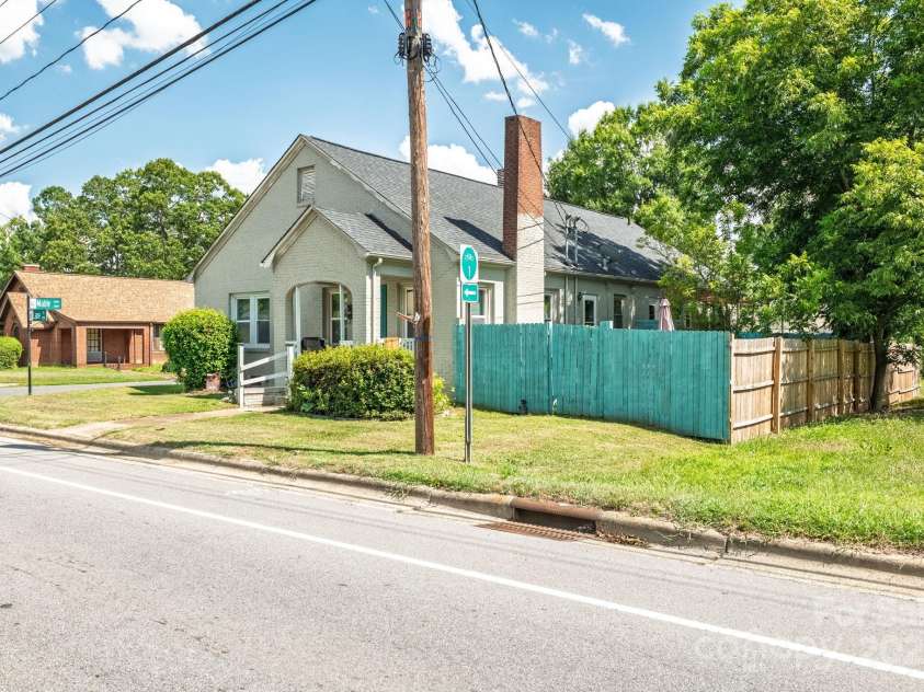 1106 Lane Street, Kannapolis, NC 28083.  MLS# CAR4285081, YatesRealty ID 28477. 1106 Lane St Exterior with Fenced in Backyard