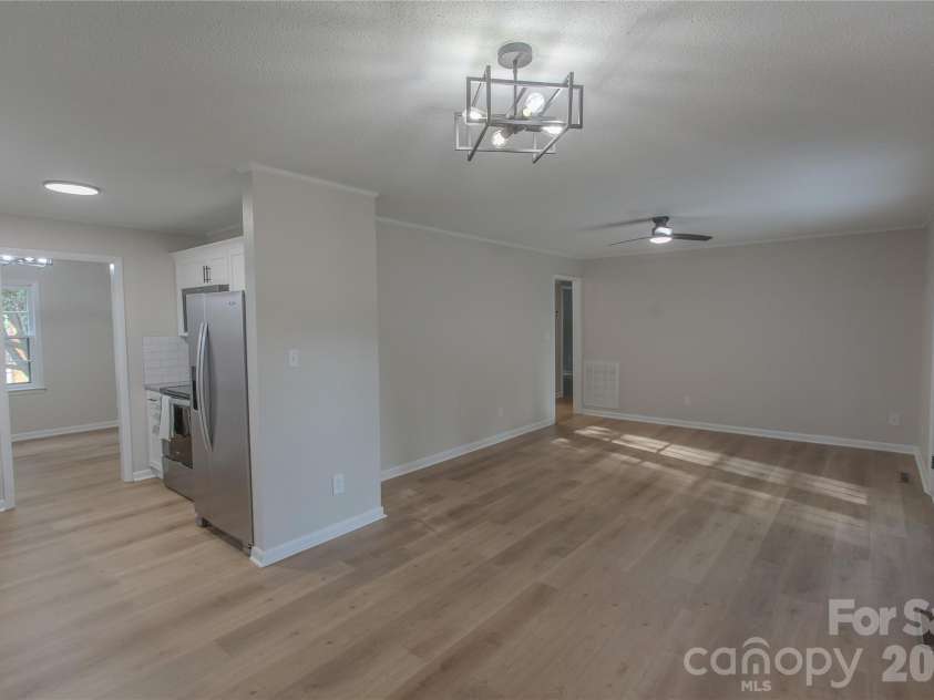 1880 Woodridge Circle, Hickory, NC 28602.  MLS# CAR4389605, YatesRealty ID 28477. Back living/dining room